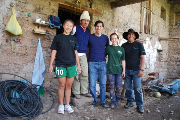 Richard ProWorld volunteers pose with Peruvian receipient of stove ProWorld volunteers