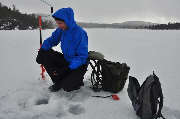 frozen lake fishing lapland ice fishing